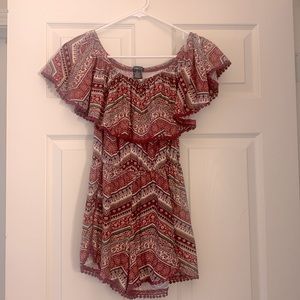 Multi color pattern romper. Colors of dark pink, black, baby pink .